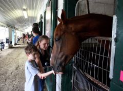 &#039;Pender&#039; greets young racing fans on a backstretch tour... (McCalmont Photo)